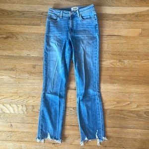 PAIGE Cindy mid rise straight meg with a destructed him. Super stretch fabric